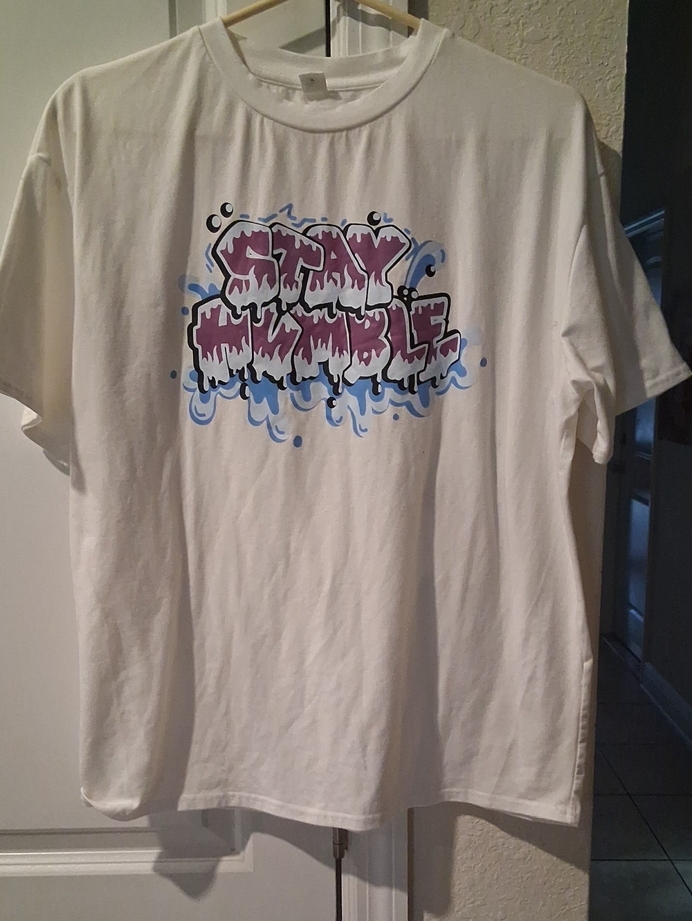 F:  White Graphic Tee with Purple Water Drip Design